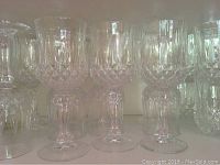 Close-up view of crystal wine glasses showing cut diamond pattern and stems