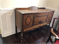 Full front view of vintage wooden sideboard showing overall design and form