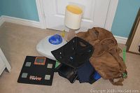 Overview of lot showing scale, two sports bags, lamp and humidifier on carpet
