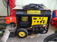 Front and left side view of black and yellow Champion generator showing control panel, wheels and coiled cord on top
