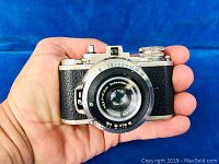 Front view of the Bolta Photovit camera showing the Schneider-Kreuznach lens and shutter speed dial.