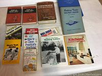 Photo of ten how-to books arranged on white surface, showing titles and cover details visually confirming seller description.