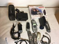 Toshiba Cable Modem in box, additional cable modem device, Dymo LetraTag label maker, remotes, mouse, wires, electric foot pedal control, RCA box and various cables.