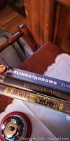 Stack of three DVDs (Slings & Arrows Season 3, Russian Ark, Jewel Crown) on wood surface