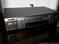 Front angle view of Samsung VHS home theatre video system with visible buttons and input ports.