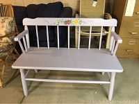 Full view of the wooden bench showing overall structure and color