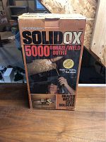 Original packaging box of SolidOX 5000 O Braze/Weld Outfit showing product name and capabilities.
