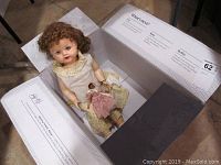 Photo of 20 inch Saucy Walker doll laying in an open box labeled with doll details