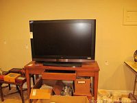 Westinghouse 42 inch television front view on wooden table showing screen and label.