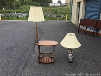 Photo showing both the MCM side table with built-in floor lamp and the separate Asian theme table lamp on pavement.
