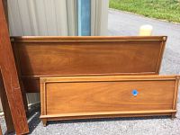 Full view of headboard and footboard panels showing Mid-Century Modern wood construction and brass corner details.