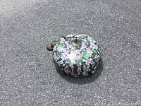 Top view of Tiffany style ceiling light fixture showing floral stained glass shade and pull chain switch.