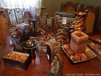 Wide table view showing all included items such as tin magazine rack, vases, bookends, candle holders, and decorative accessories