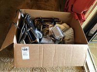 Box filled with various ladies' purses and wallets showing different sizes and textures