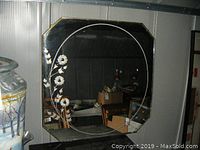 Full view of the vintage square mirror with etched floral design on one side.