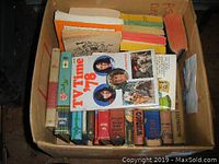 Box of vintage books including TV Time '78 and 1976 Best Buys & Discount Prices Consumer Guide on top.