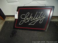 Front view of the Schlitz light up beer sign showing the full sign and power cord.