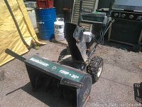 Front left view showing auger housing, Mastercraft branding and clearing width marking