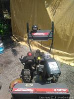 Front view showing control panel, light, brand decal and auger housing