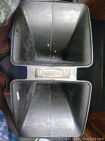 Top view of metal horn speaker showing flared design and interior surface.