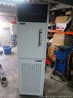 Full frontal view of the vertical electronic air purifier showing vent slats and control panel.