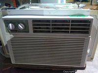 Front view of Forest Air window AC unit showing control panel with two knobs and adjustable air vents