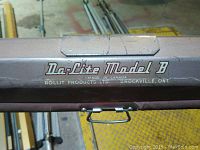 Close-up of Dalite Model B branding on the metal casing.