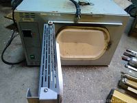 Front view of the Barnstead Thermoline 62700 furnace showing the device door open with the interior chamber visible.