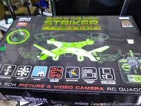 Box of the glow in the dark green Stryker Spy Drone with technical specifications and images of the drone on the packaging.
