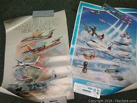 Two vintage aviation posters side by side on a carpeted surface, one of de Havilland aircraft, the other of Canadair airplanes, both produced by CDIC.