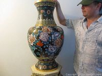 Front view of large cloisonné vase showing overall shape and floral motifs