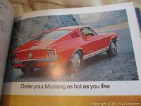 Open magazine page showing red Ford Mustang advertisement