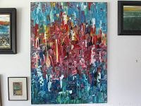 Full view of painting hung on wall among other artworks