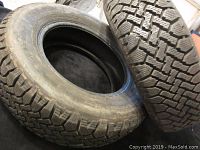 Two Wintermark Magnagrip tires side by side showing overall tire appearance and sidewall details.