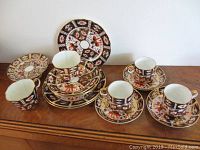 Overview of Royal Crown Derby Imari cups, saucers, plates and Aynsley pieces