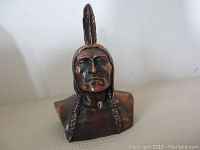 Front view of the bronze/copper finish Native American bust money bank