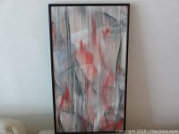 Full view of framed acrylic painting on paper by Andrew Plum titled 'Machine Age' showing abstract vertical brush strokes in red, black and gray.