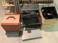 Overall lot showing Kodak projector in case, slide trays, boxes and screen