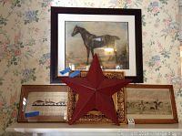 Five wall art items displayed: horse painting, Currier and Ives print, two framed prints, metal star