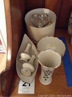 Lenox holiday-themed vase, bowls, long dish, salt and pepper shakers, and glass heart trinket box.