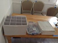 Storage boxes on table for glasses and flatware, showing lot bulk
