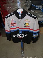 Front view of Dale Earnhardt NASCAR zip-up jacket showing Goodwrench and other sponsor logos
