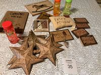 Photo of 4 wooden magnets, 6 tin stars, 2 blank books, 3 bottles of bubbles, Tooth Fairy pillow, and small tin sign on lace tablecloth