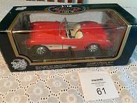 Red Chevrolet Corvette die cast model car in its original Road Tough Collection box.
