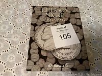 Front cover of Jefferson Nickel collection book 1962-1995 shows large nickel image and title.