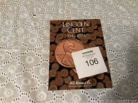 Cover of H.E. Harris & Co. Lincoln Cent Coin Book dated 1941-1974, featuring a large Lincoln penny image and coin collection title.