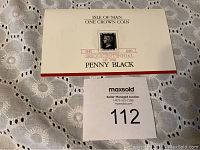 Front of white/cream descriptive folder featuring Isle of Man One Crown Coin 1990 Sesquicentennial of the Penny Black with image of Penny Black stamp