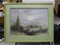 Framed pastel drawing showing a misty forest landscape with a cabin, trees, and distant mountains.
