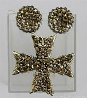 The full set showing the Maltese cross brooch alongside the round earrings with aurora topaz rhinestones.
