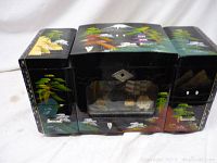 Front and side view of the painted Oriental wooden dresser box showing detailed landscape with Mount Fuji, pagodas, and trees.